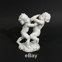 Antique, porcelain figurine Fighting Cherubs. K. Tutter for Hutschenreuther