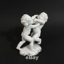 Antique, porcelain figurine Fighting Cherubs. K. Tutter for Hutschenreuther