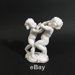 Antique, porcelain figurine Fighting Cherubs. K. Tutter for Hutschenreuther