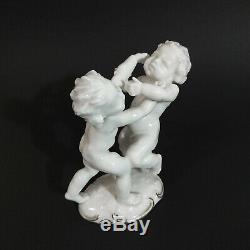 Antique, porcelain figurine Fighting Cherubs. K. Tutter for Hutschenreuther