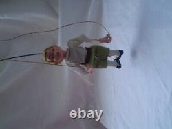 Antique porcelain figurine boy dancing with a rope