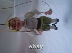Antique porcelain figurine boy dancing with a rope