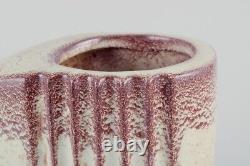 French ceramicist. A pair of Art Deco jug-shaped vases with handles