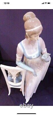 Lladro Lady Empire Porcelain Retired Figurine with tall chair and dog. Mint Cond