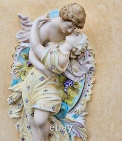 Vintage bisque porcelain bas-relief plaque of lovers in a gold frame Italy
